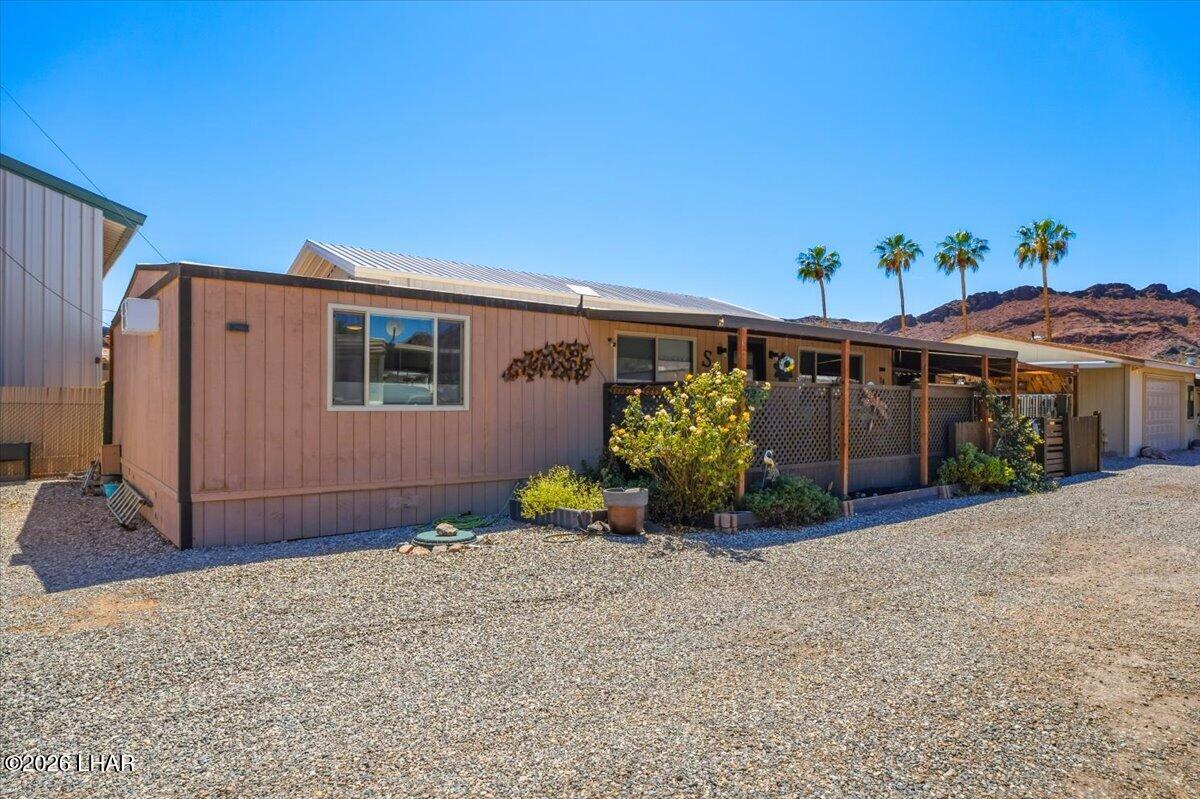 3170 Parker Dam Road, Unit 18 Parker, AZ 85344 - Photo 2 of 88 a front view of a house with garden