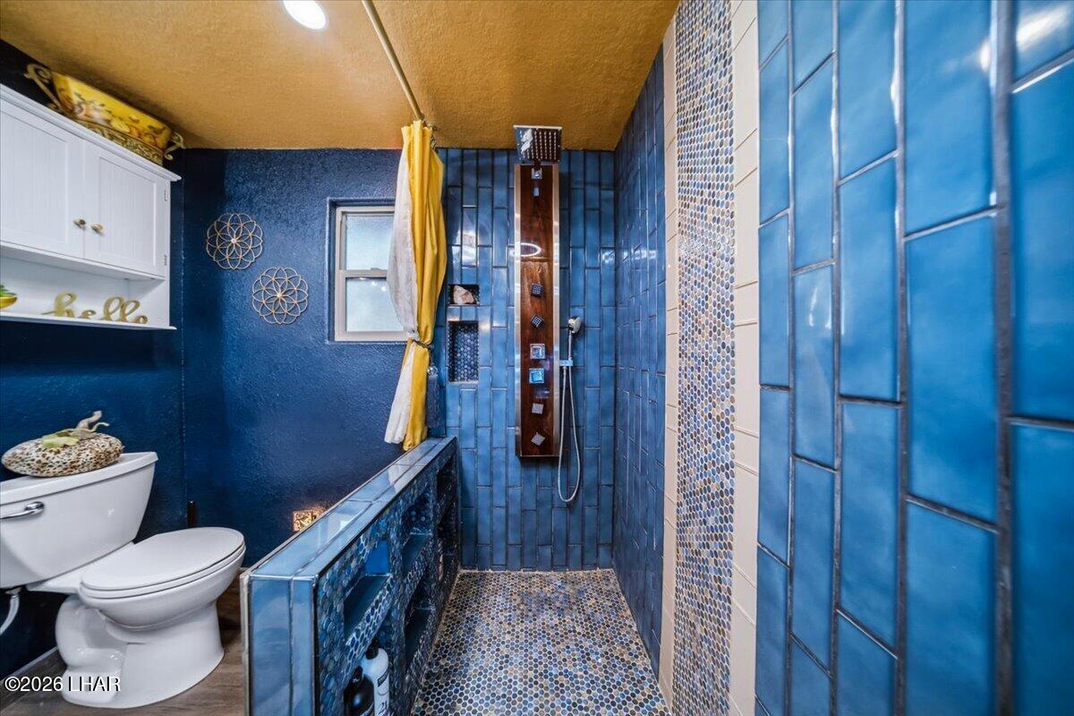 3170 Parker Dam Road, Unit 18 Parker, AZ 85344 - Photo 22 of 88 a bathroom with a toilet and a shower