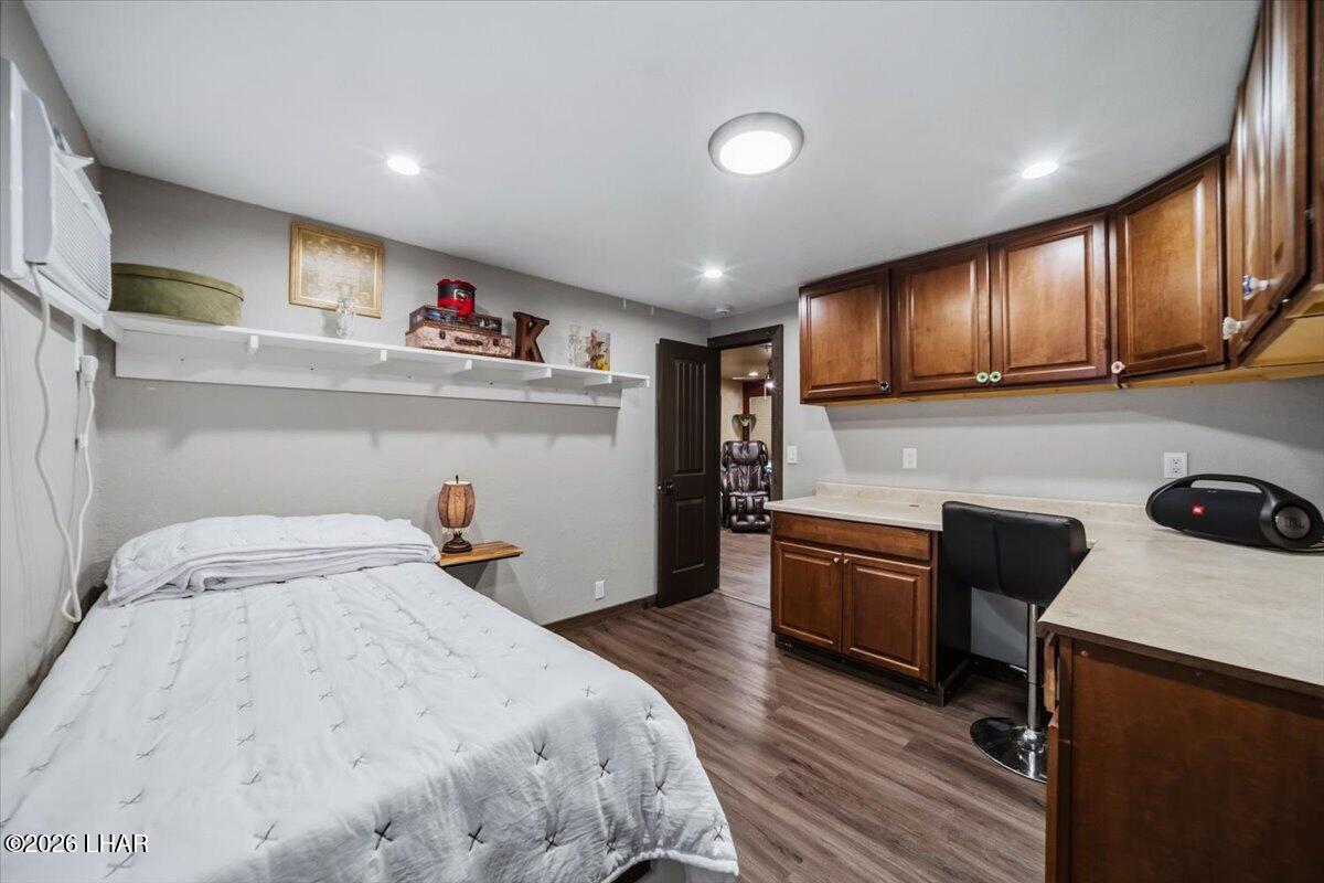 3170 Parker Dam Road, Unit 18 Parker, AZ 85344 - Photo 24 of 88 a bedroom with a bed and cabinets