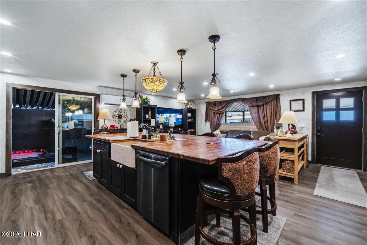 3170 Parker Dam Road, Unit 18 Parker, AZ 85344 - Photo 3 of 88 a kitchen with stainless steel appliances granite countertop a sink a stove and a wooden floors