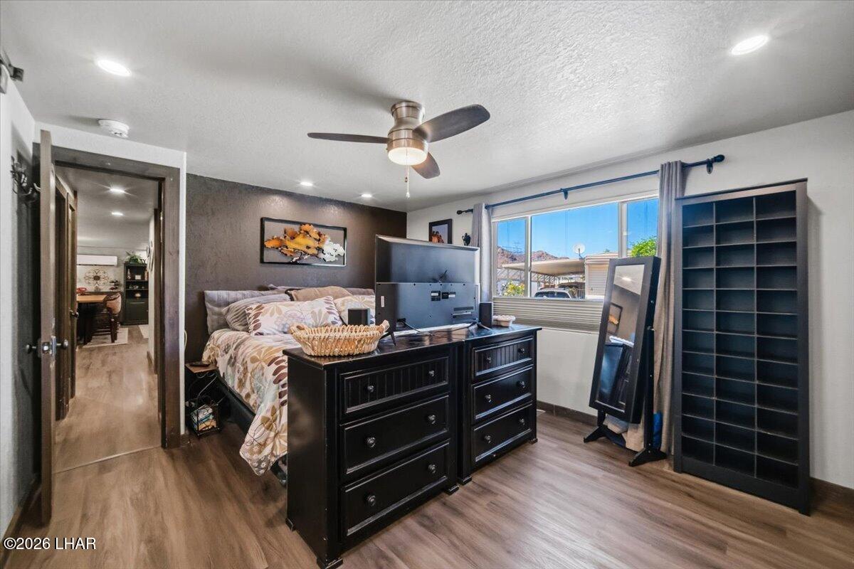 3170 Parker Dam Road, Unit 18 Parker, AZ 85344 - Photo 30 of 88 a bed room with a bed and a television