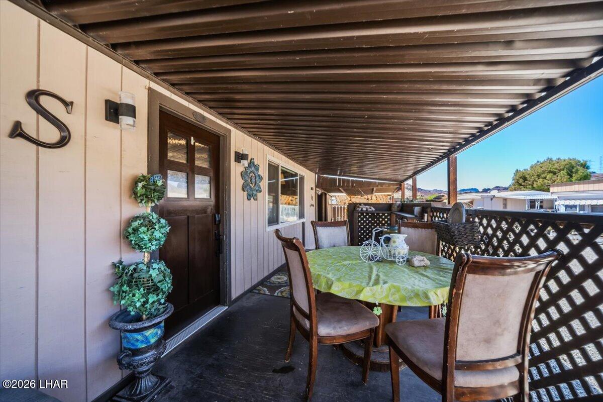 3170 Parker Dam Road, Unit 18 Parker, AZ 85344 - Photo 45 of 88 a dining room with furniture and potted plants