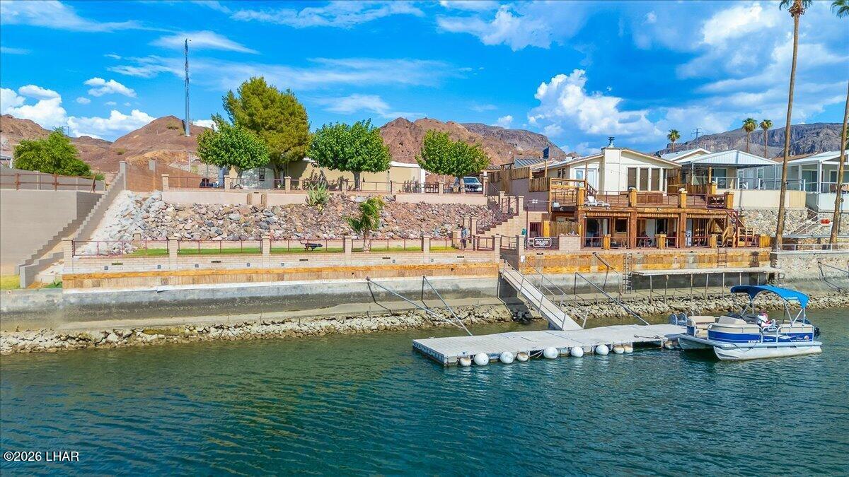3170 Parker Dam Road, Unit 18 Parker, AZ 85344 - Photo 61 of 88 a view of a swimming pool with a yard