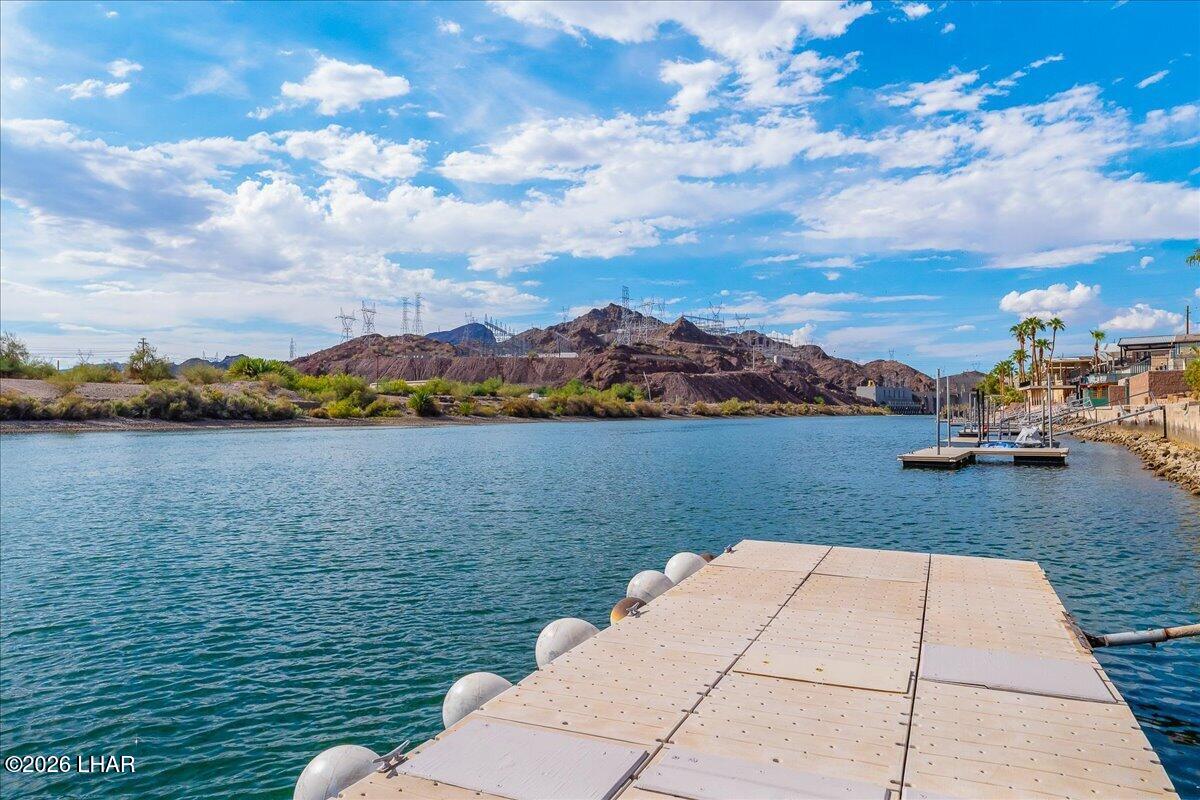 3170 Parker Dam Road, Unit 18 Parker, AZ 85344 - Photo 65 of 88 a view of a lake with houses in the back