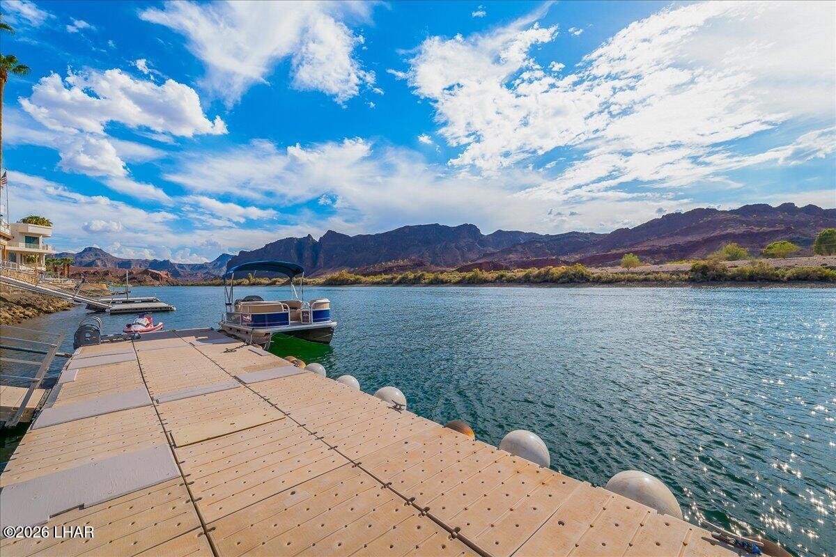 3170 Parker Dam Road, Unit 18 Parker, AZ 85344 - Photo 67 of 88 a view of a lake with a mountain in the background