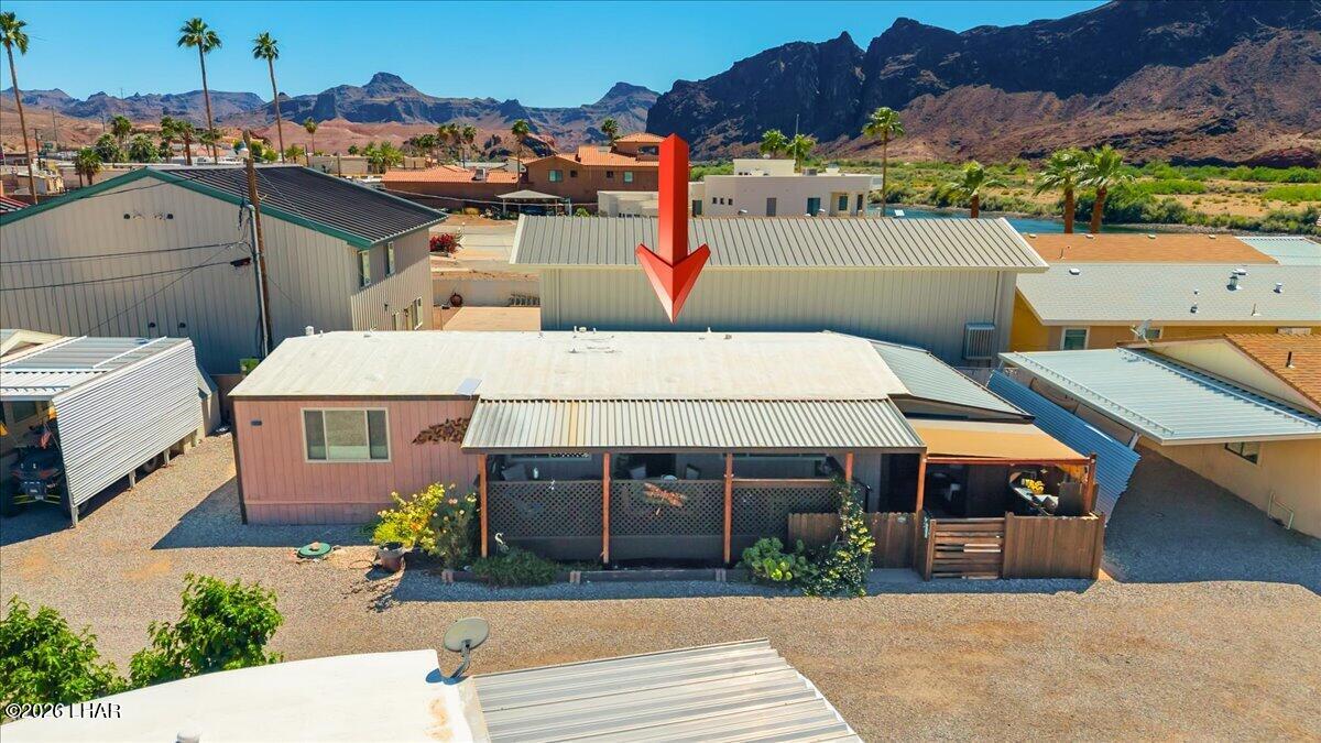 3170 Parker Dam Road, Unit 18 Parker, AZ 85344 - Photo 79 of 88 a aerial view of a house with a garden