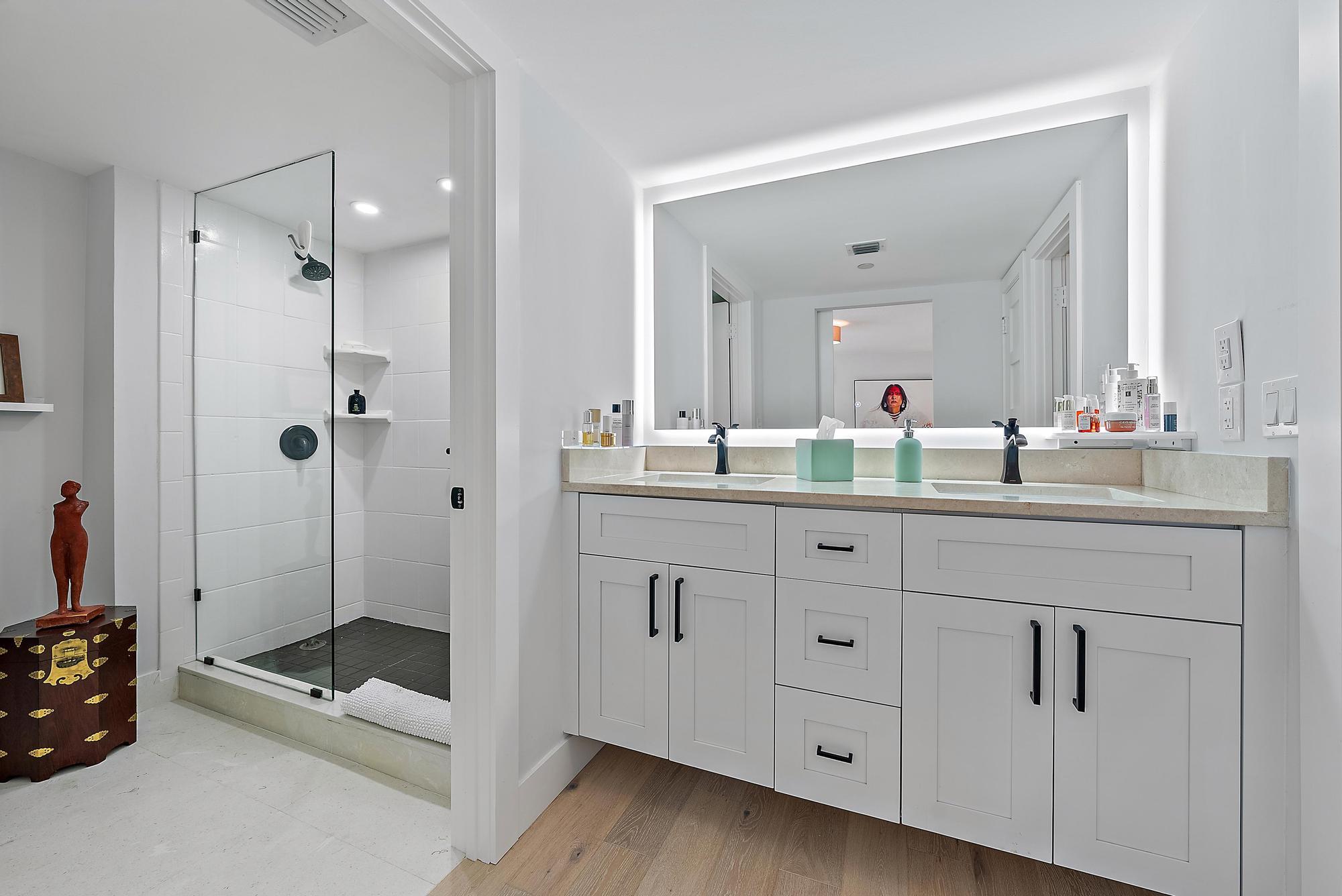 326 Oak Harbour Drive Juno Beach, FL 33408 - Photo 16 of 41 a bathroom with a double vanity sink mirror and double