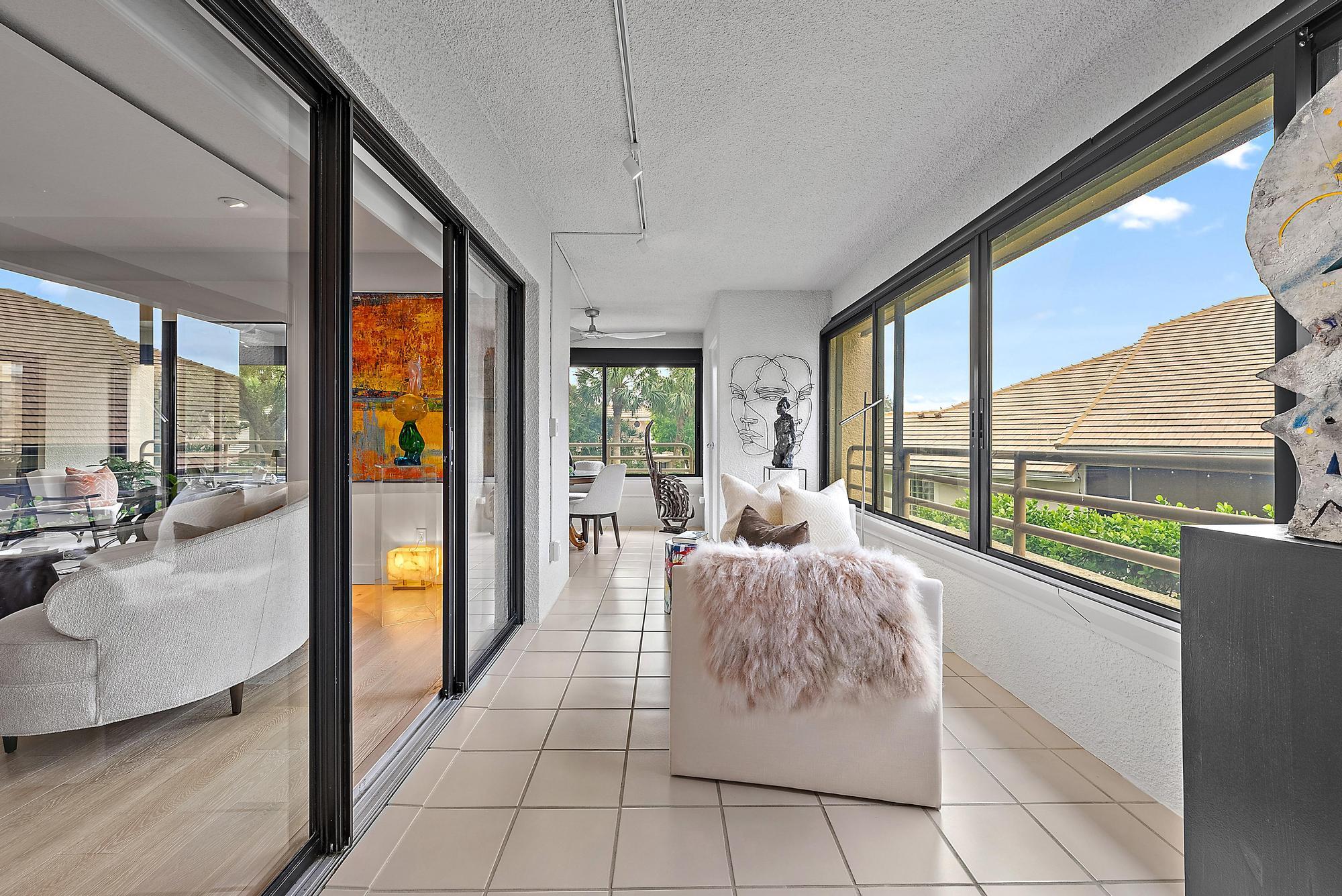 326 Oak Harbour Drive Juno Beach, FL 33408 - Photo 18 of 41 a living room with furniture and large windows