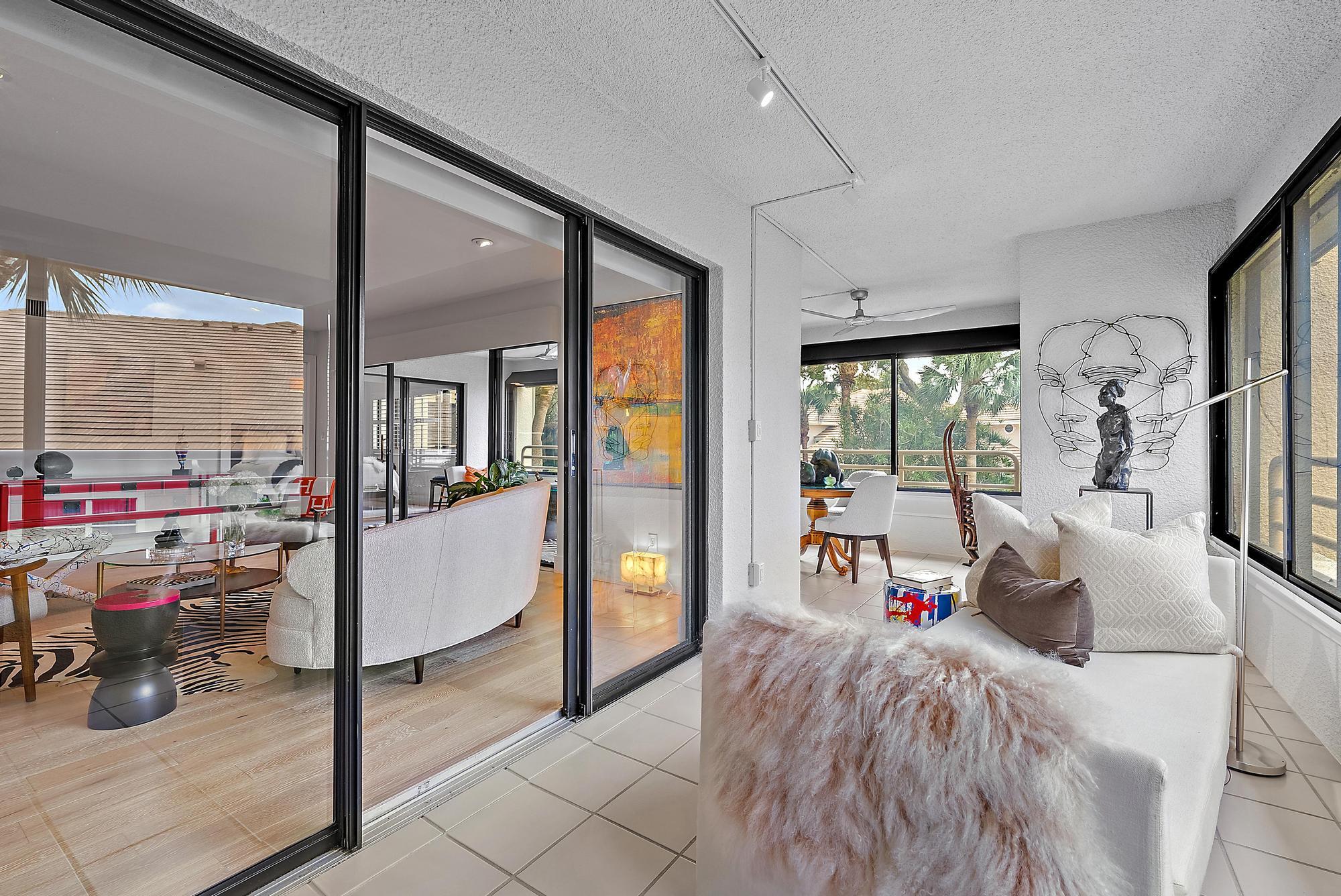 326 Oak Harbour Drive Juno Beach, FL 33408 - Photo 19 of 41 a bed room with a bed and glass door