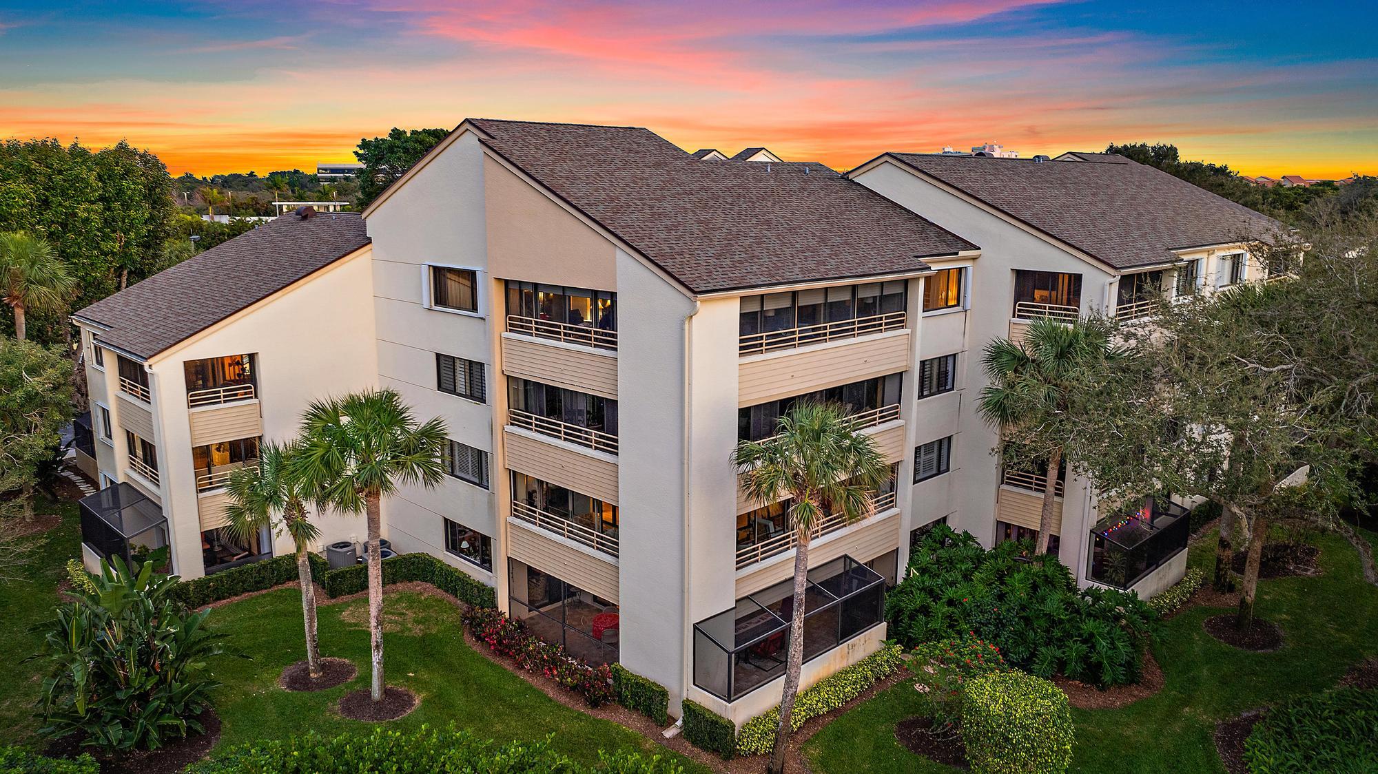 326 Oak Harbour Drive Juno Beach, FL 33408 - Photo 2 of 41 a house with trees in front of it