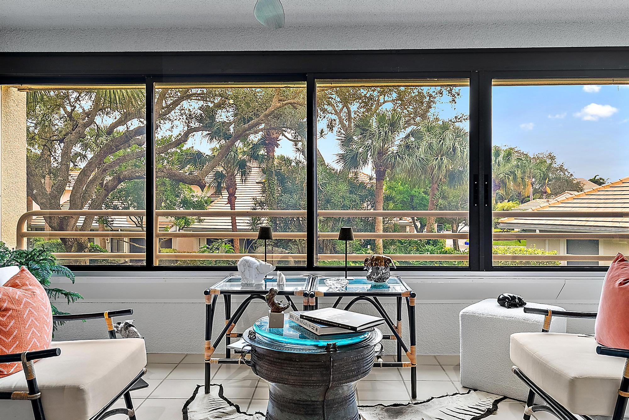 326 Oak Harbour Drive Juno Beach, FL 33408 - Photo 21 of 41 a living room with furniture and a floor to ceiling window