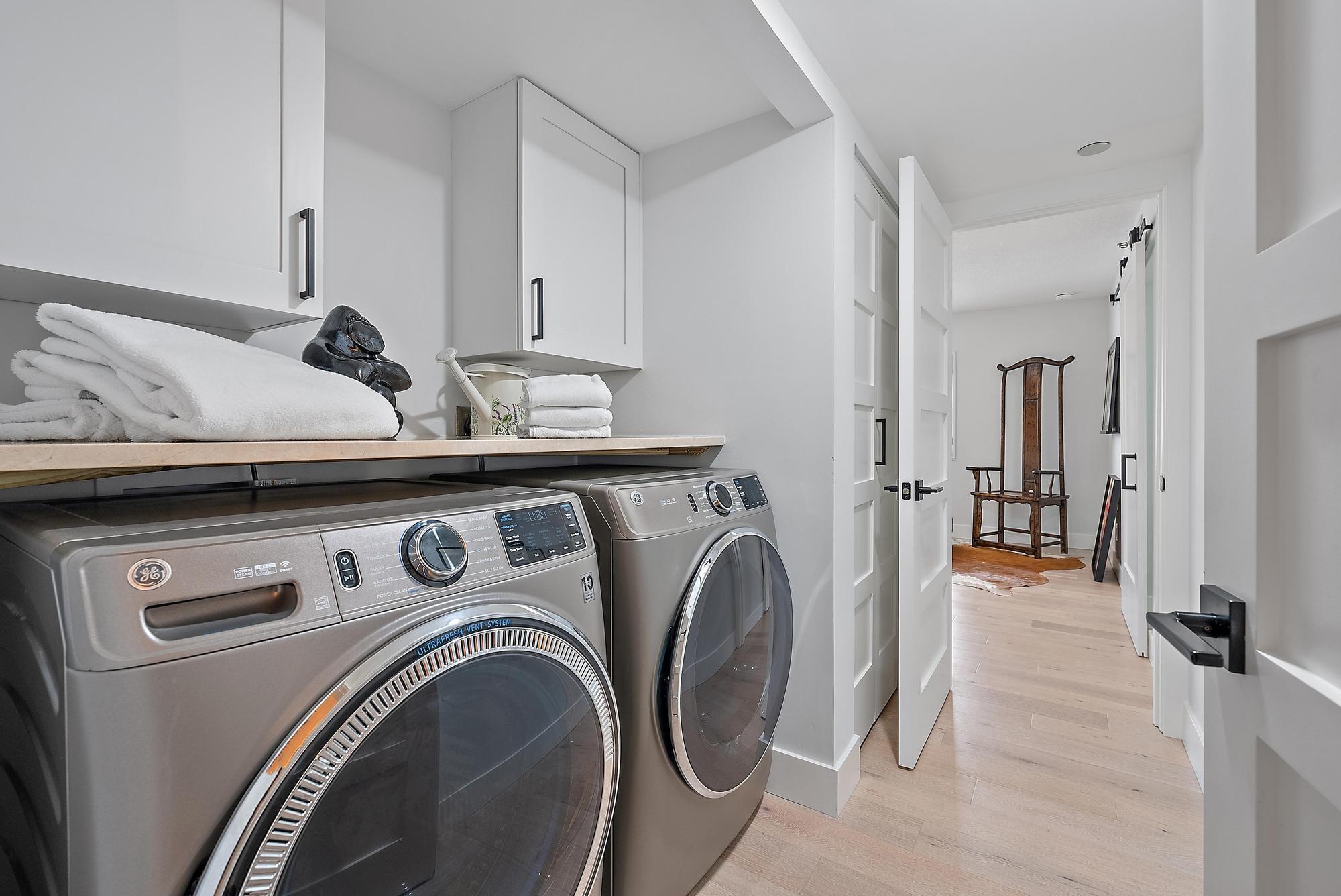 326 Oak Harbour Drive Juno Beach, FL 33408 - Photo 30 of 41 a utility room with dryer and washer