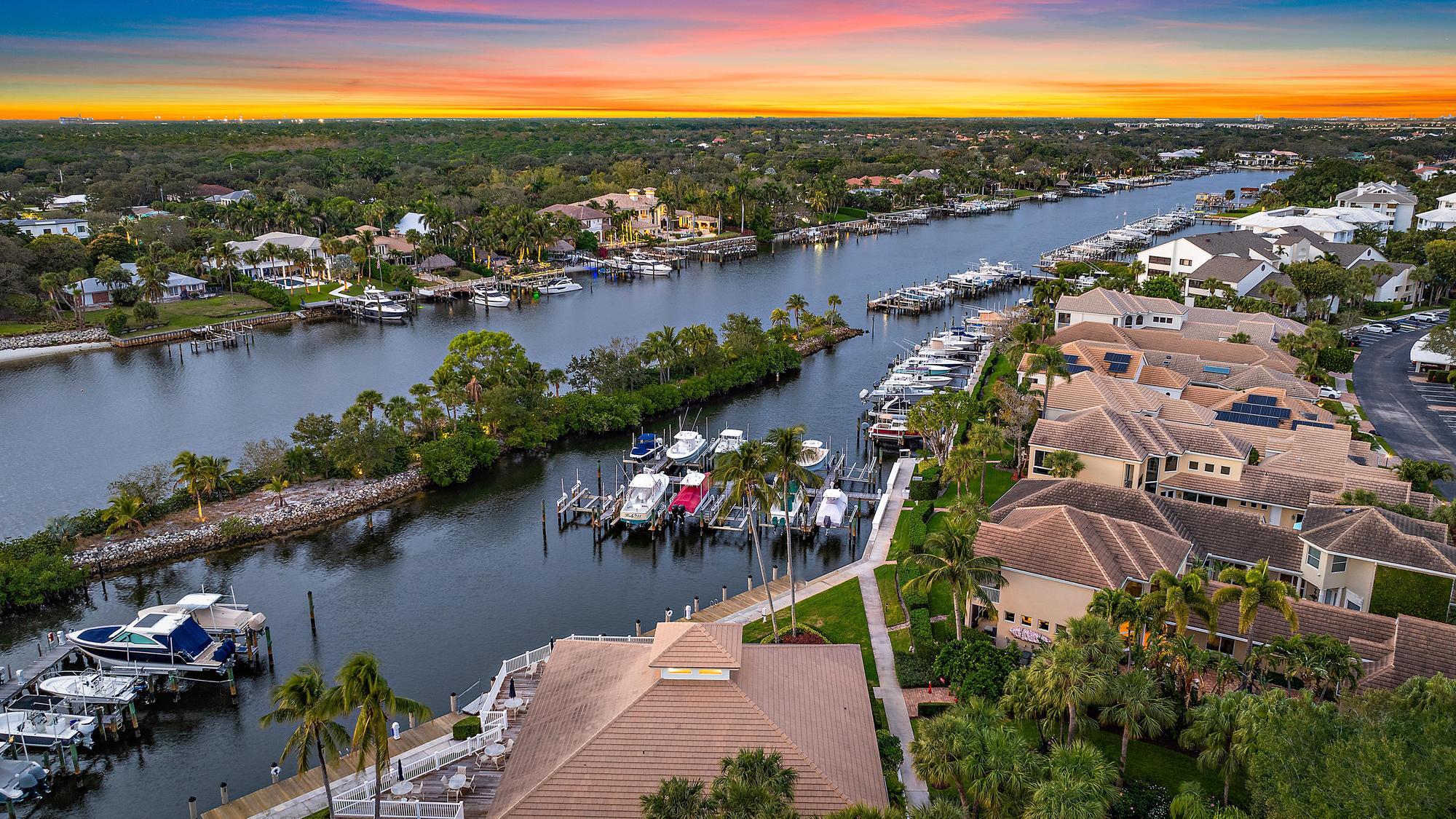 326 Oak Harbour Drive Juno Beach, FL 33408 - Photo 33 of 41 an aerial view of residential houses with outdoor space and lake view