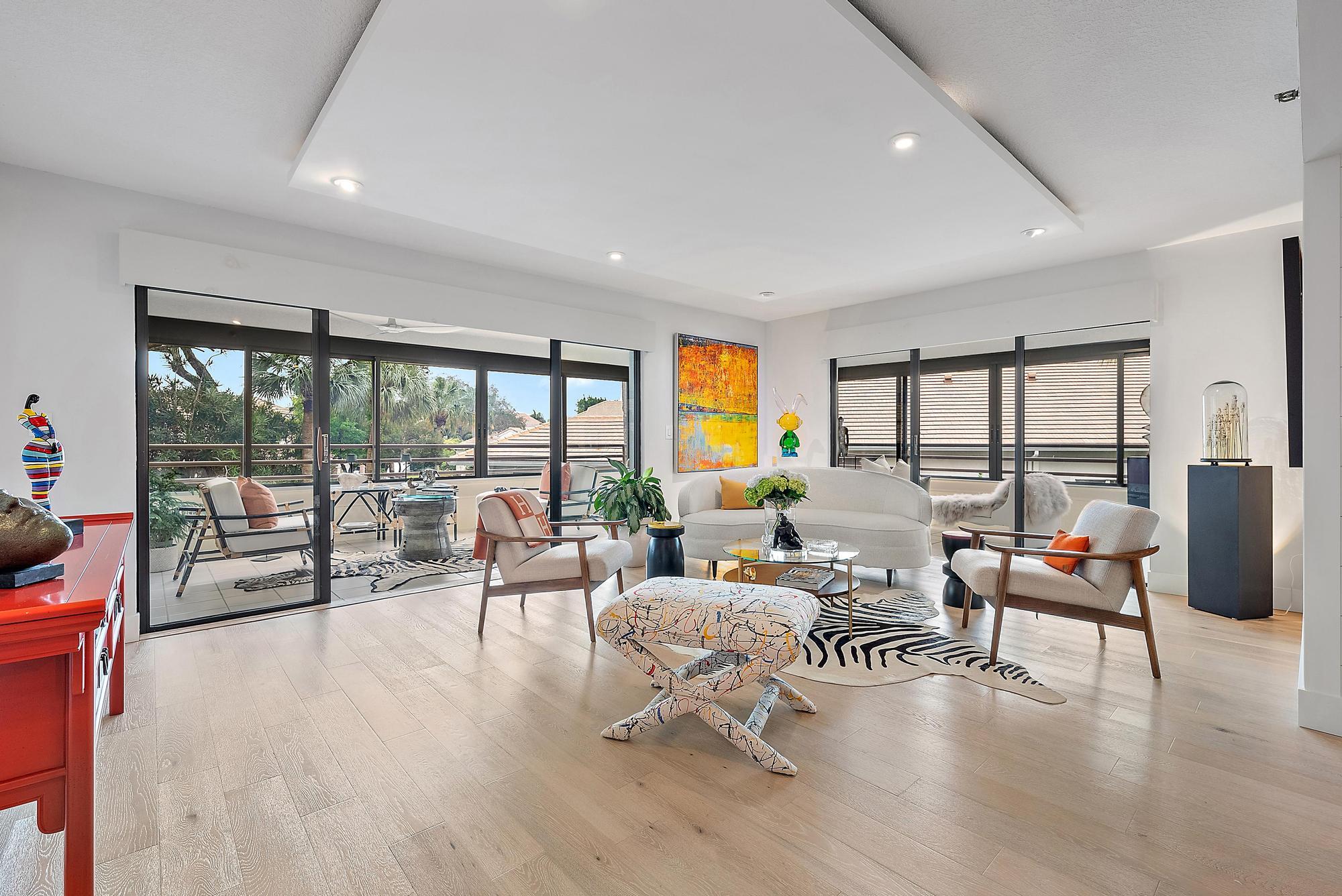 326 Oak Harbour Drive Juno Beach, FL 33408 - Photo 7 of 41 a living room with furniture and a large window with outer view