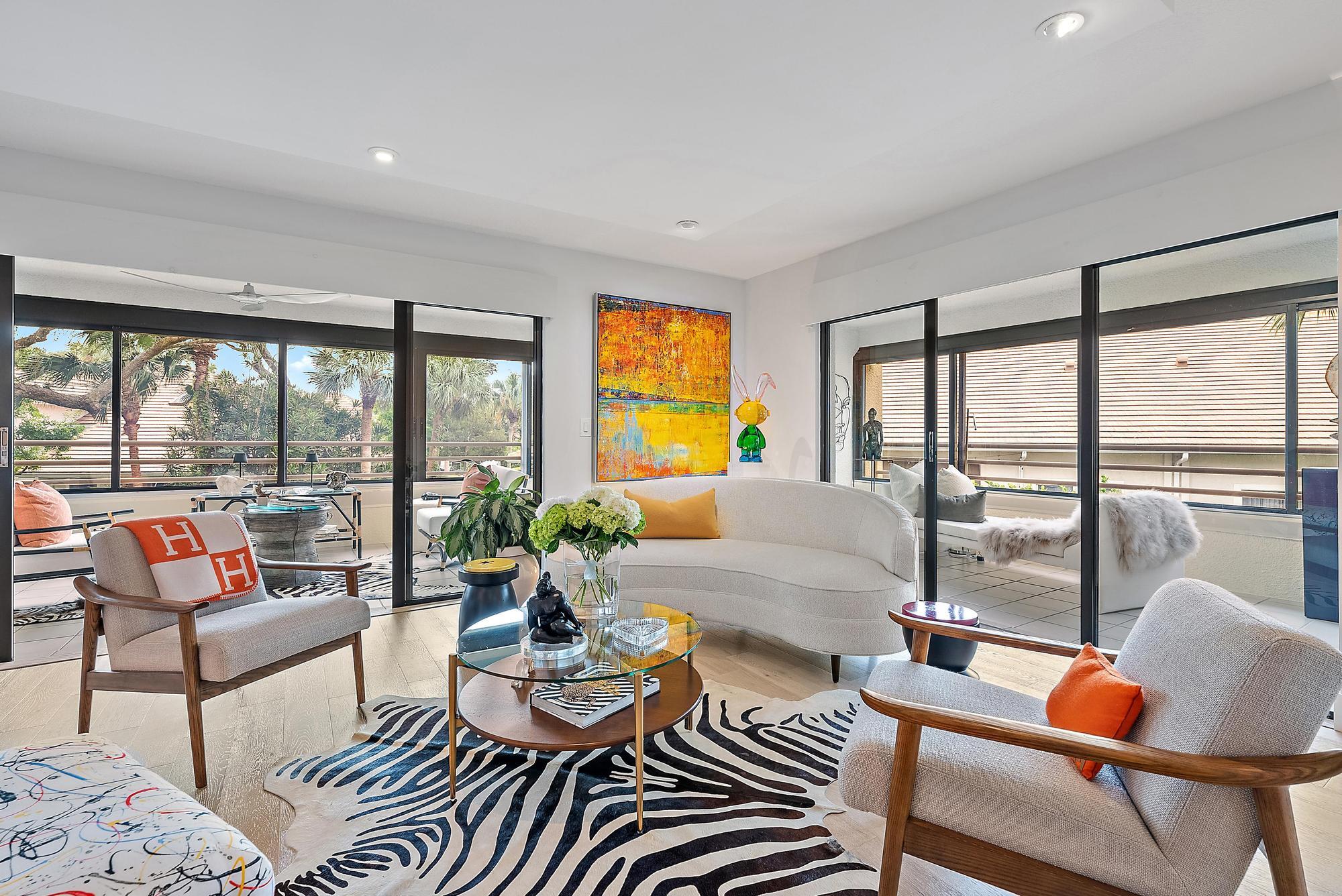 326 Oak Harbour Drive Juno Beach, FL 33408 - Photo 8 of 41 a living room with furniture and a large window