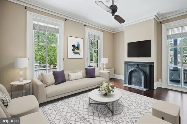 a view of a hallway with wooden floor and chandelier