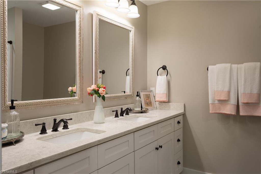 393 Scout Road Lexington, NC 27292 - Photo 36 of 47 The lovely hall bathroom is shared by bedrooms 2 and 3. With more than enough space for two to get ready at the same time this room just as beautiful as the rest of the house.