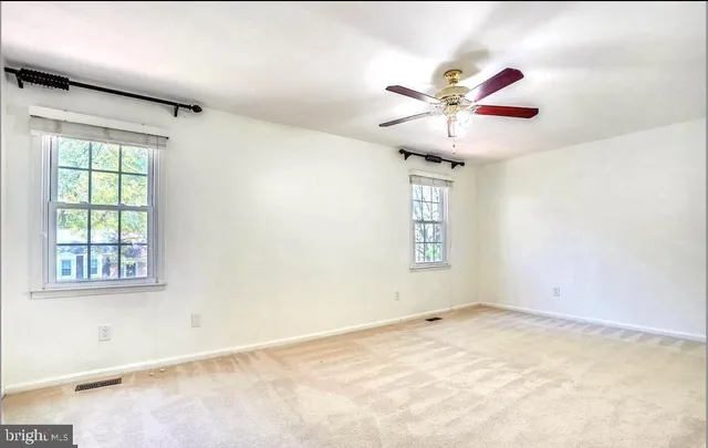 an empty room with windows