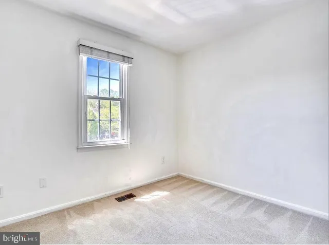 a bathroom with a bathtub a sink and a mirror