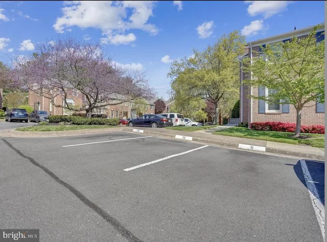 a kitchen with stainless steel appliances granite countertop a refrigerator a stove and a sink