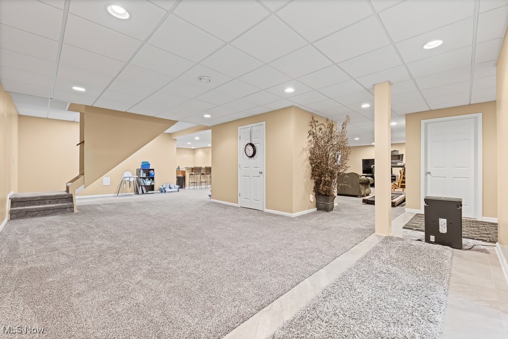 369 Eldridge Road Aurora, OH 44202 - Photo 26 of 50 Finished Recreation area featuring carpet, stairs, a drop ceiling, and recessed lighting