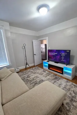 a bedroom with a bed and a mirror