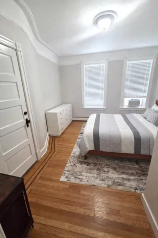 a bathroom with bathtub and shower