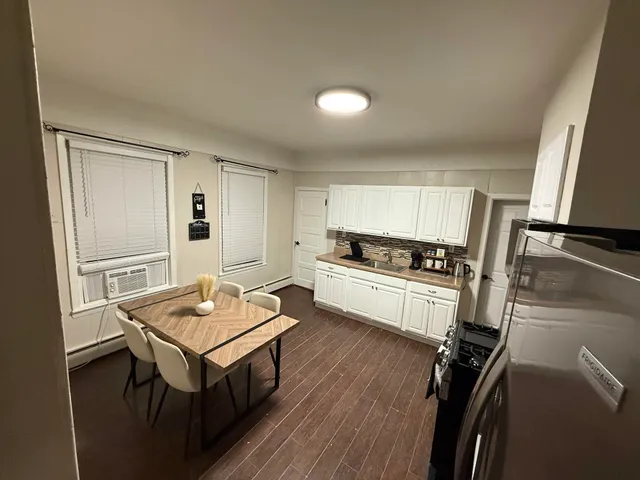 a view of a kitchen from a hallway