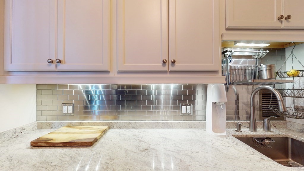 85 East India Row, Unit 19H Boston, MA 02110 - Photo 16 of 23 a view of a living room and bathroom with bathtub