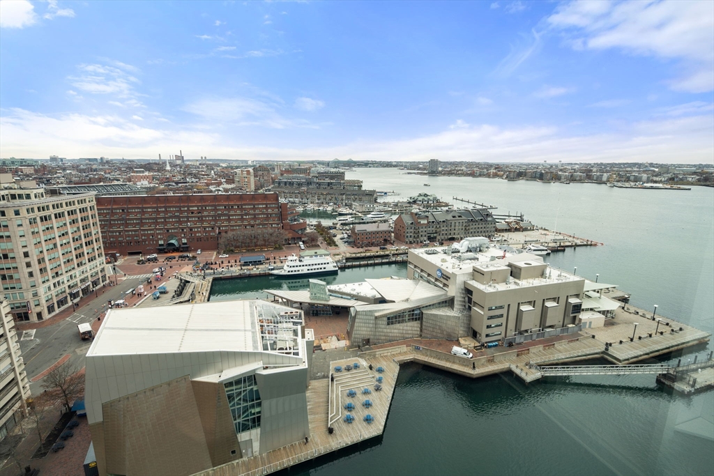 85 East India Row, Unit 19H Boston, MA 02110 - Photo 18 of 23 a view of a lake with building in front of it