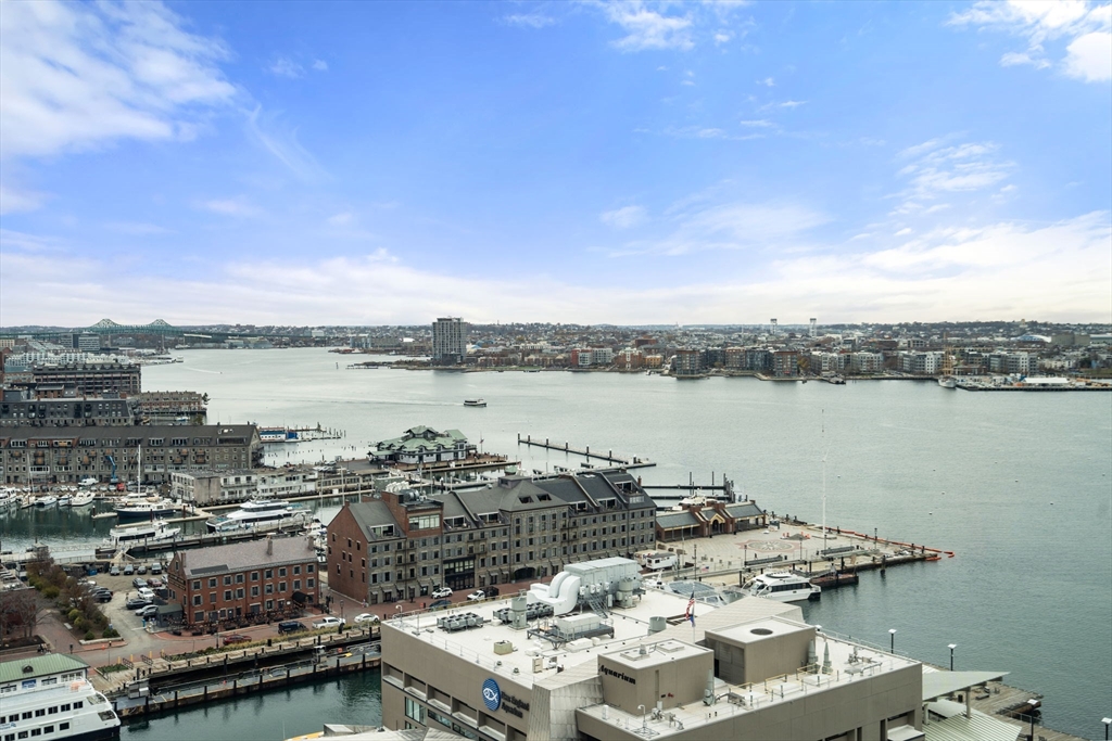 85 East India Row, Unit 19H Boston, MA 02110 - Photo 6 of 23 a view of a lake with a city view