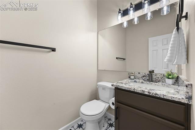 5428 Rondo Way Colorado Springs, CO 80911 - Photo 16 of 43 Half bath on main floor off living room