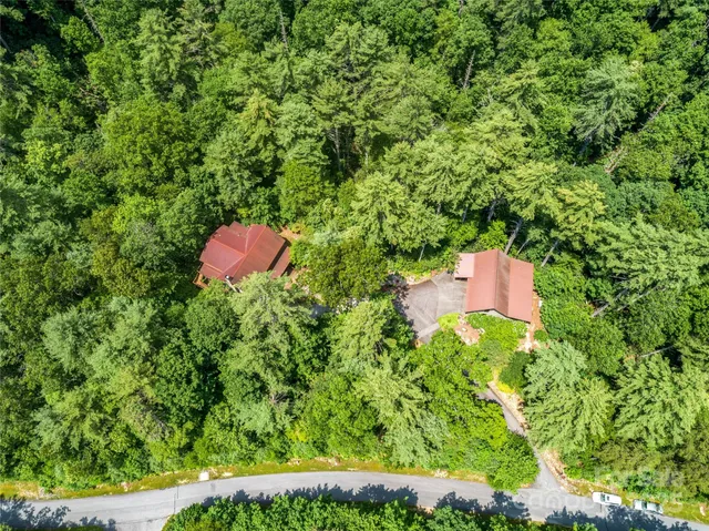 a living room with fireplace furniture and a flat screen tv