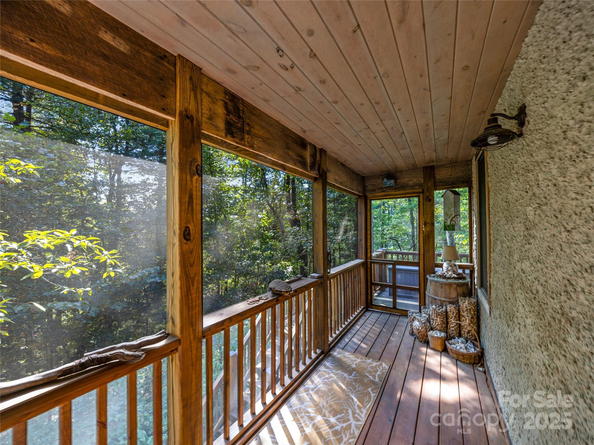 69 Dogwood Branch Road Zirconia, NC 28790 - Photo 9 of 48 a view of two chairs in the balcony