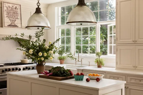 a kitchen with a stove and a white cabinet
