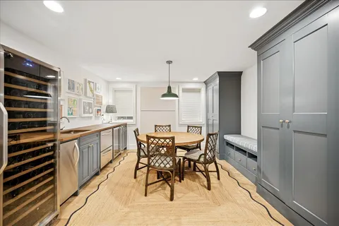 a bathroom with a toilet a sink a mirror and vanity