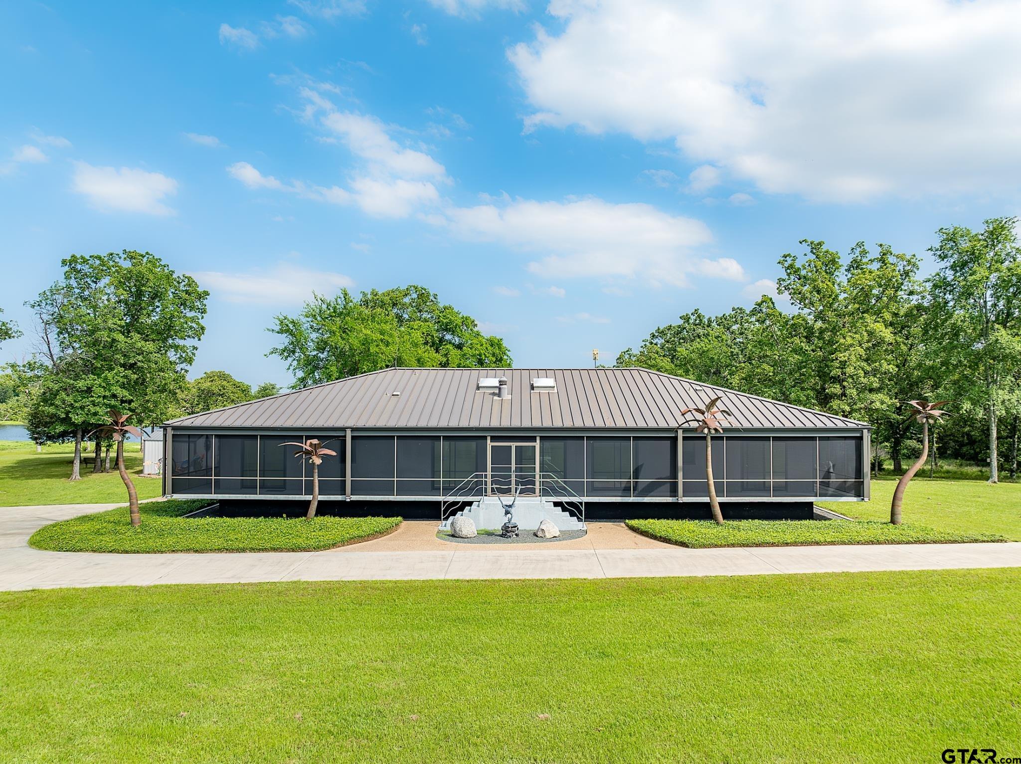 1085 County Road 1960 Yantis, TX 75497 - Photo 15 of 41 a front view of house with yard and green space