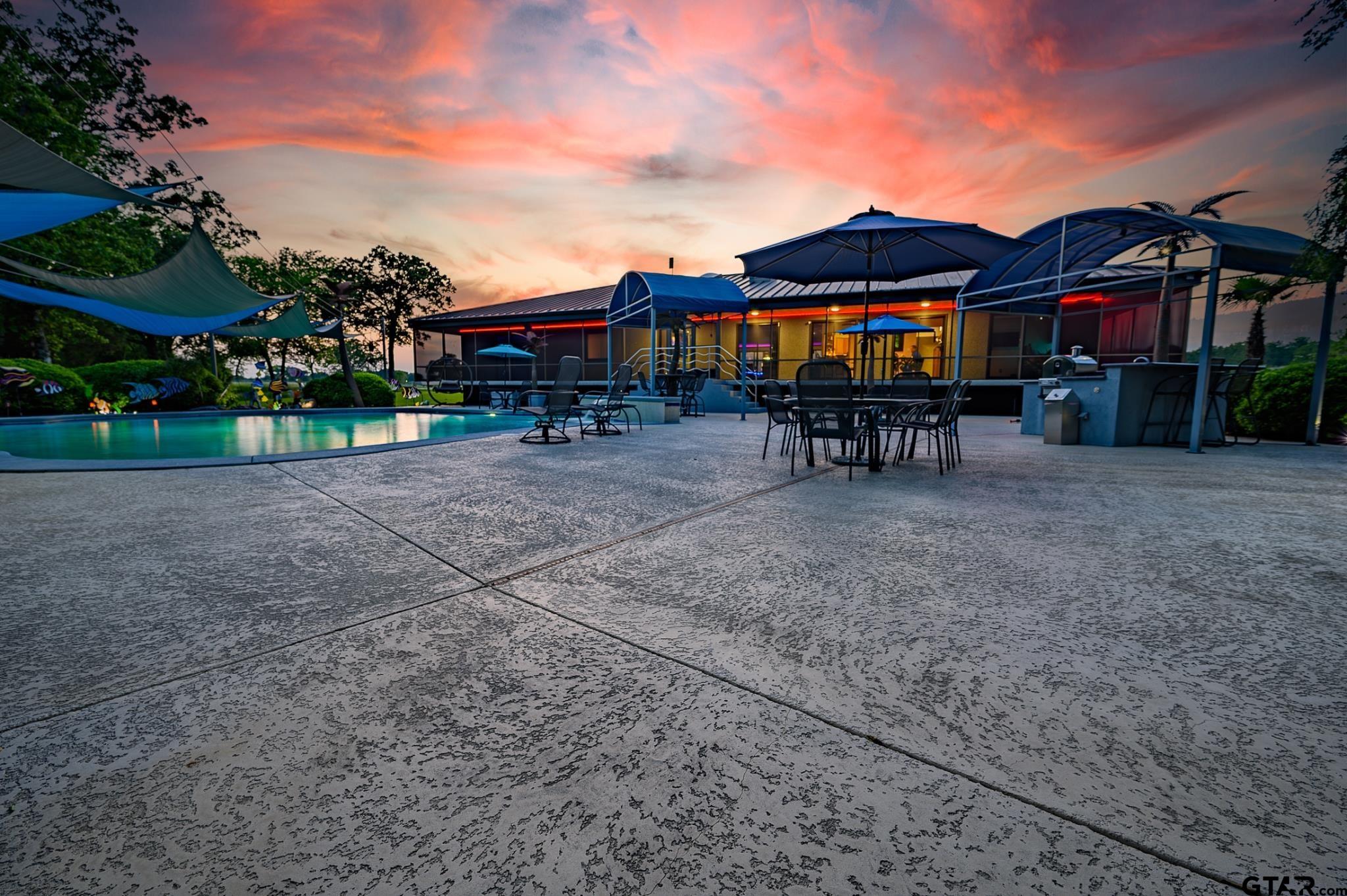 1085 County Road 1960 Yantis, TX 75497 - Photo 17 of 41 a view of a house with a yard and sitting area