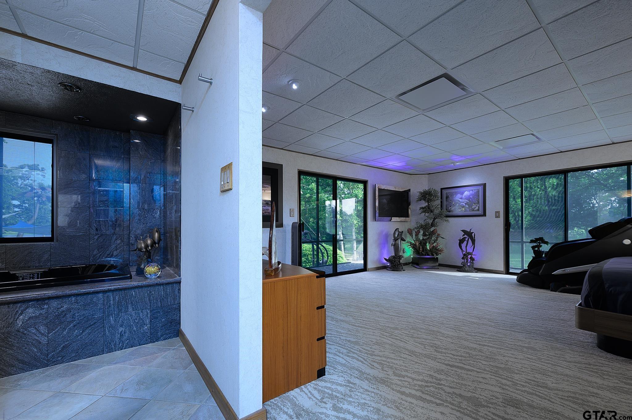 1085 County Road 1960 Yantis, TX 75497 - Photo 26 of 41 a view of a room with gym equipment and large window