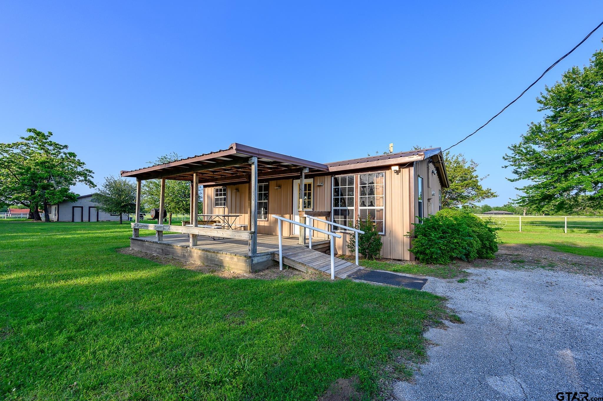 1085 County Road 1960 Yantis, TX 75497 - Photo 31 of 41 a backyard of a house with table and chairs