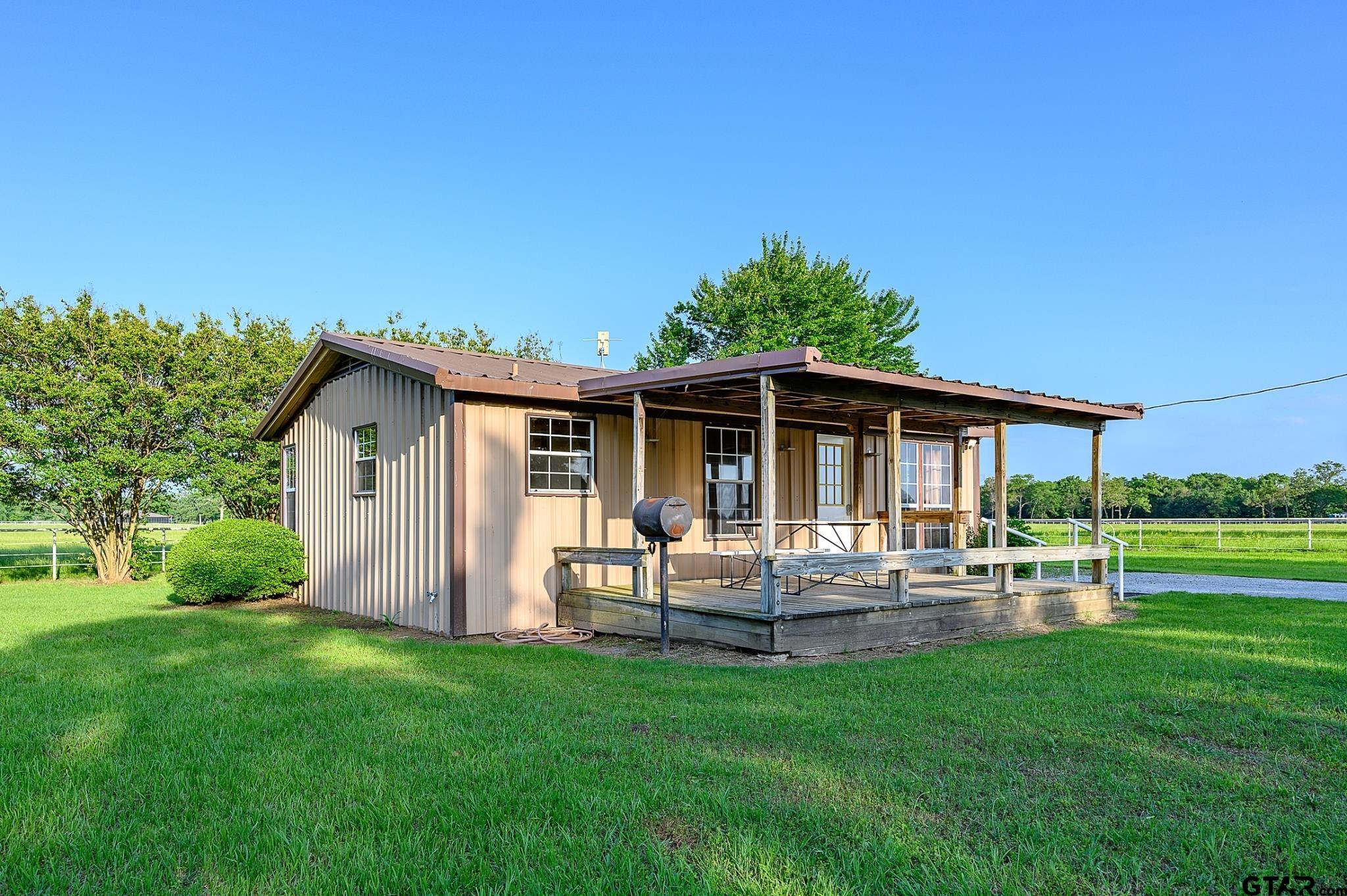1085 County Road 1960 Yantis, TX 75497 - Photo 32 of 41 a backyard of a house with table and chairs