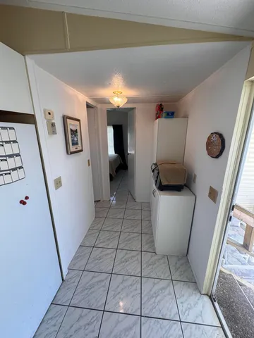 a view of living room with furniture and a flat screen tv
