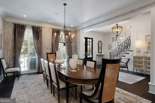 a living room with furniture and large windows