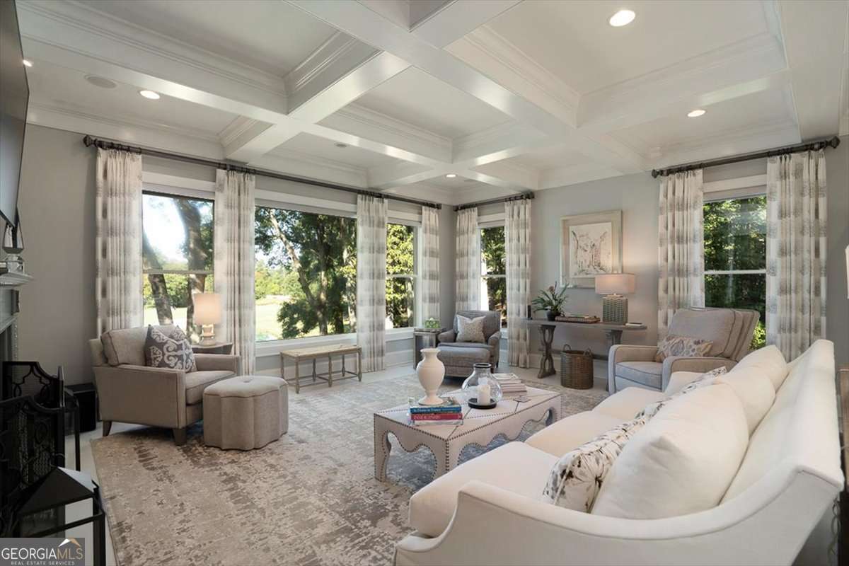 711 Bluff Road Statham, GA 30666 - Photo 19 of 70 a living room with furniture and large windows