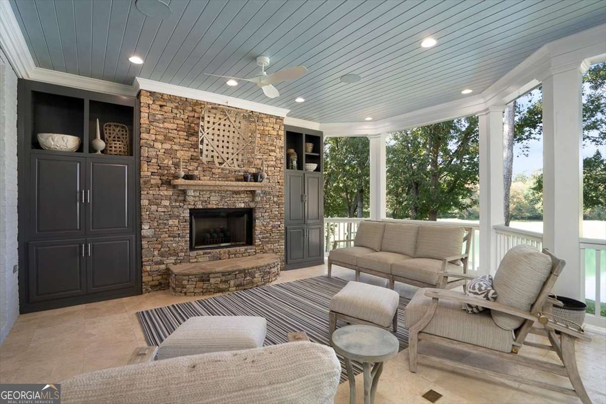 711 Bluff Road Statham, GA 30666 - Photo 22 of 79 a living room with furniture and a fireplace