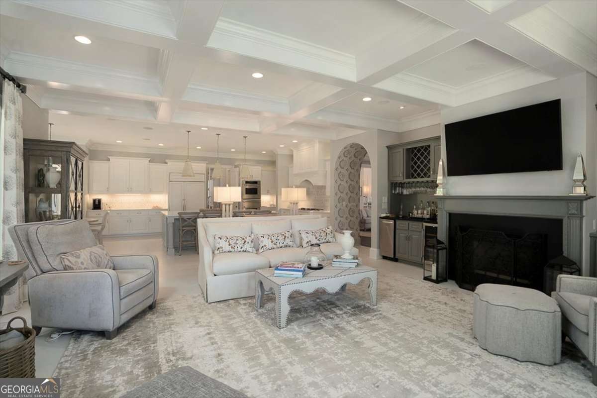 711 Bluff Road Statham, GA 30666 - Photo 26 of 79 a living room with furniture a fireplace and a flat screen tv