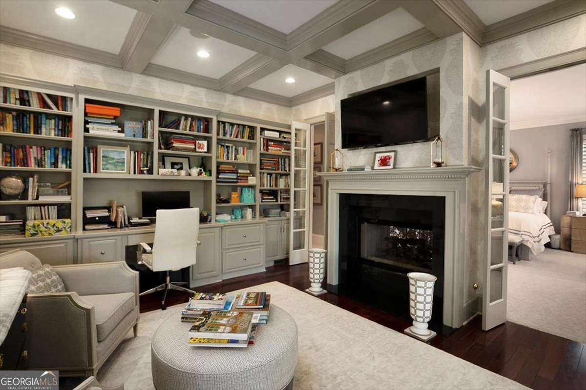 711 Bluff Road Statham, GA 30666 - Photo 36 of 70 a living room with furniture and a flat screen tv