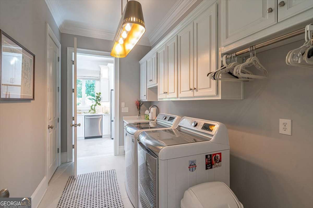 711 Bluff Road Statham, GA 30666 - Photo 36 of 79 a utility room with sink dryer and washer