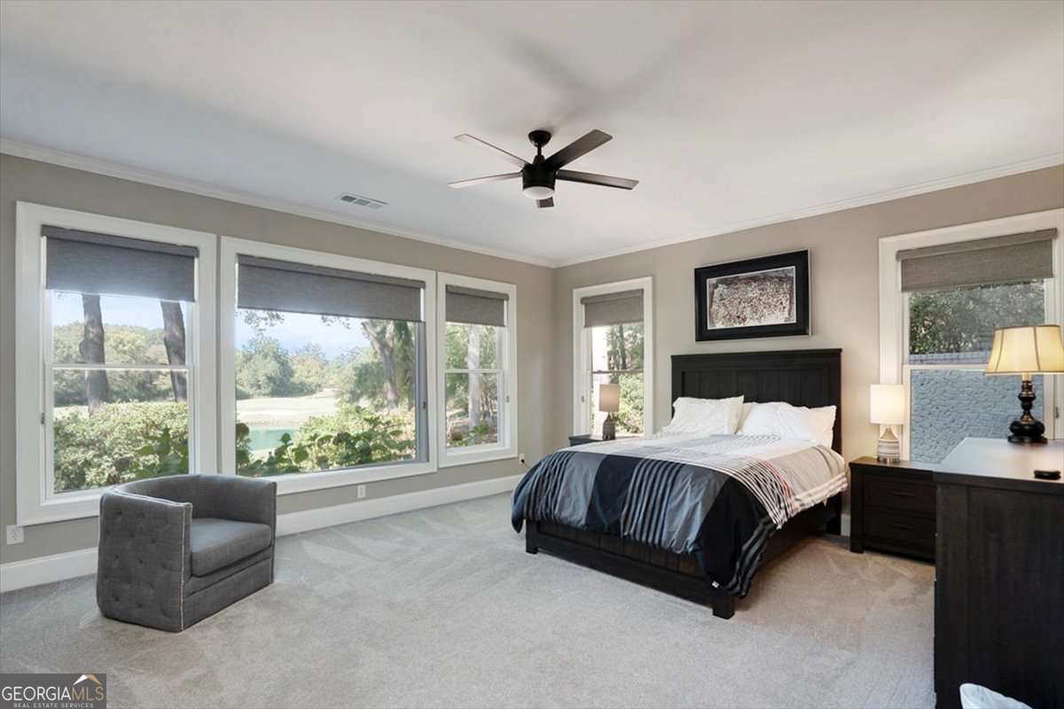 711 Bluff Road Statham, GA 30666 - Photo 52 of 70 a bedroom with a large bed and a large window