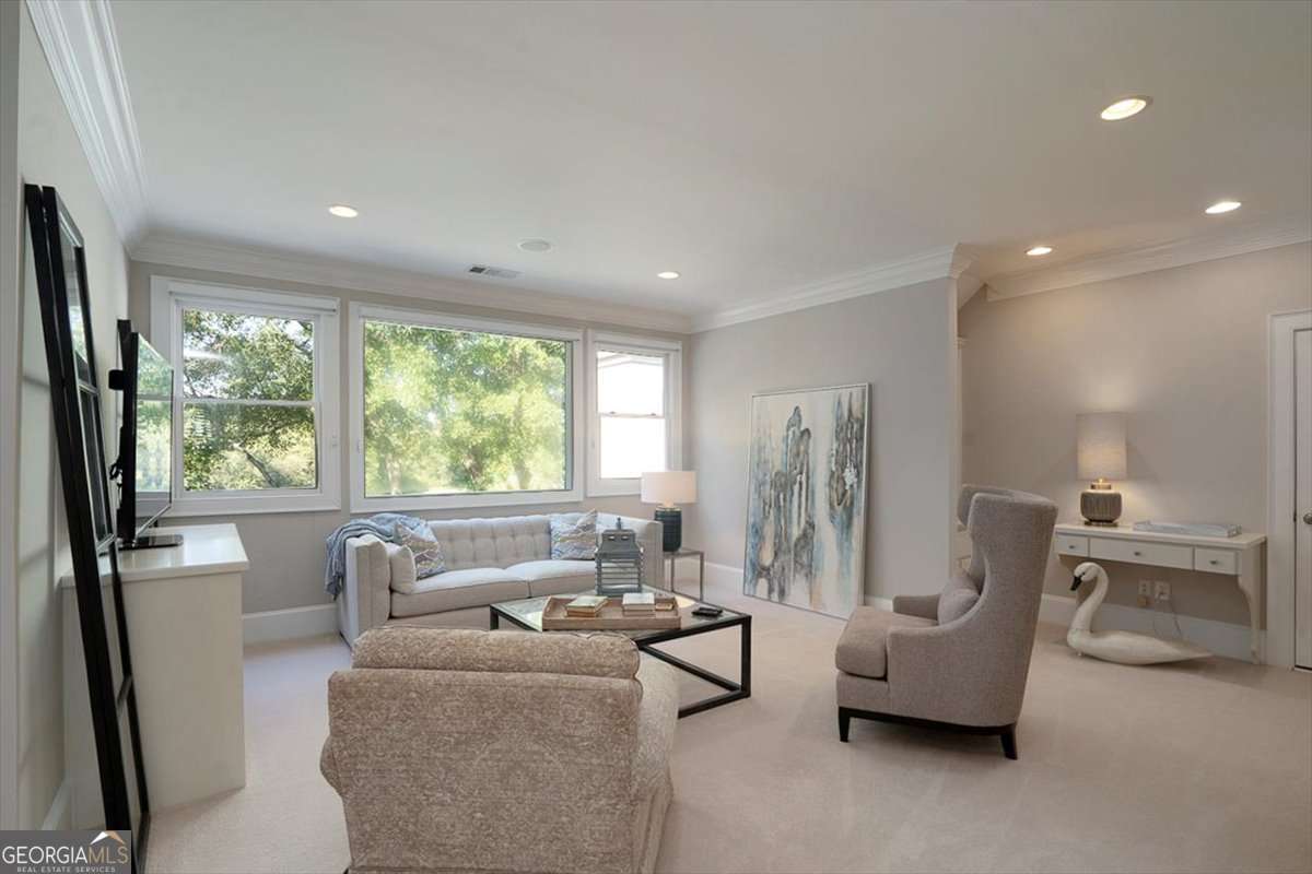 711 Bluff Road Statham, GA 30666 - Photo 52 of 79 a living room with furniture and a large window